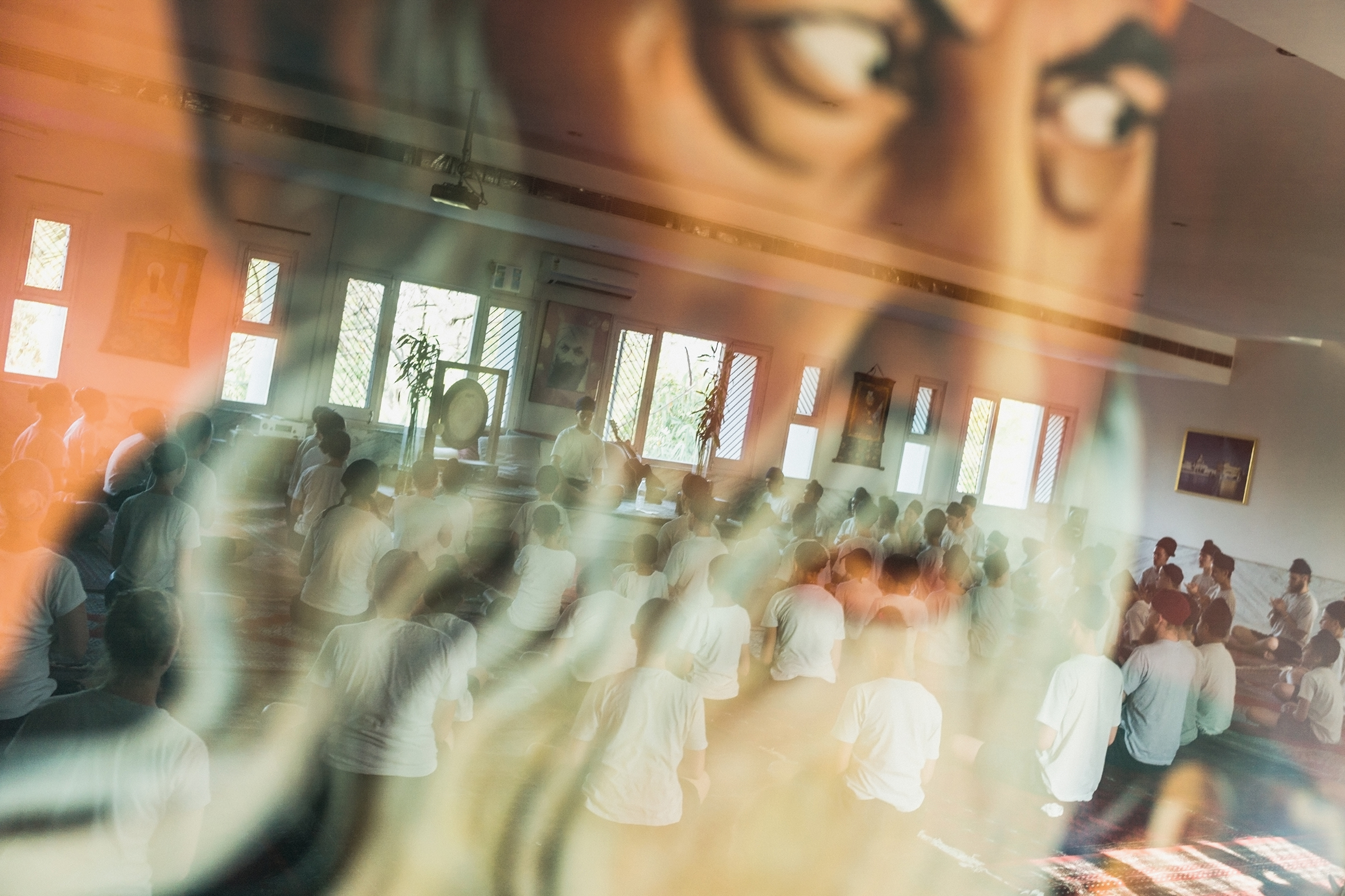 Andy Richter, Students at Miri Piri Academy practice Kundalini yoga kriyas in the reflection of Yogi Bhajan, Amritsar, India, March 29, 2013 - The Culturium